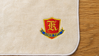 川崎市立川崎高校PTA様｜記念品ハンドタオルのエンブレム刺繍
